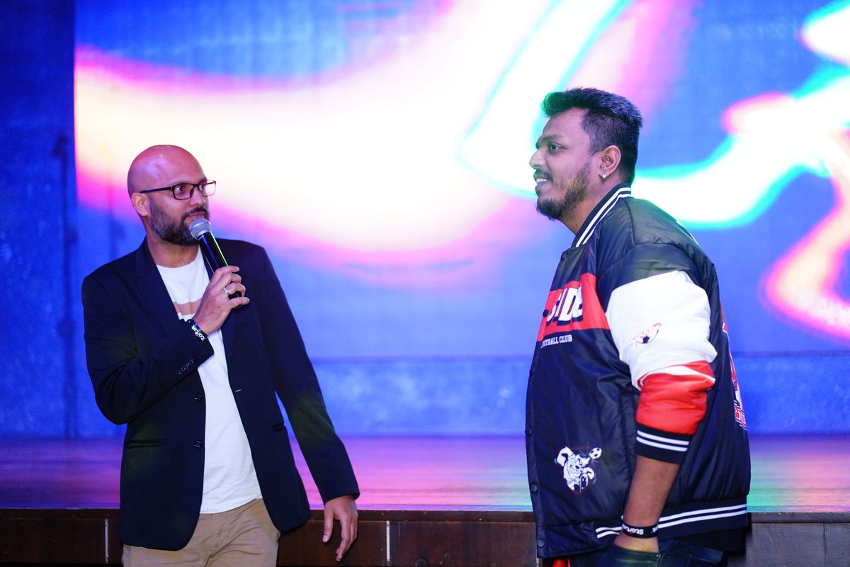 Sunil hosting a corporate event on stage in Bangalore